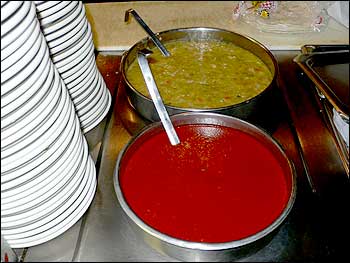 Photo Showing Red and Green Chile on the Stove